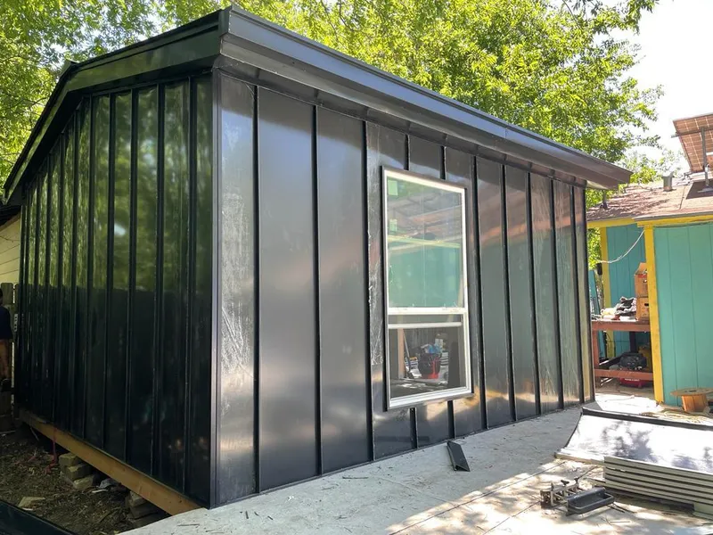 Black standing seam metal wall panels for Roof Inspection in El Segundo